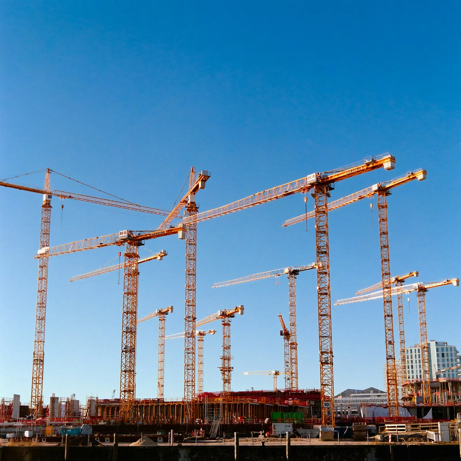Construction cranes over a build site