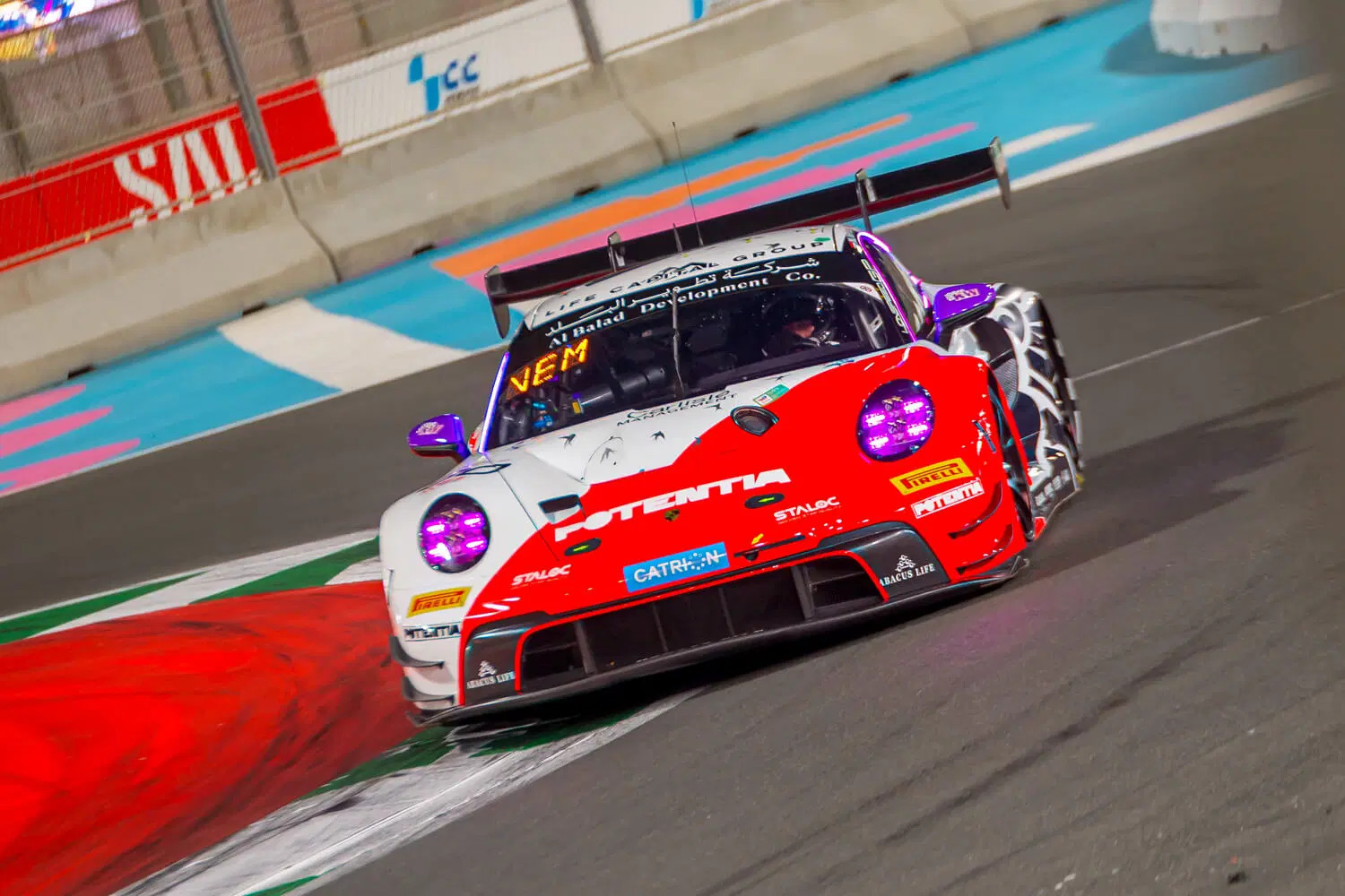 The Potentia-liveried Lionspeed GP Porsche 911 GT3 R racing on track under lights